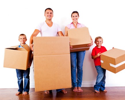 Local movers handling furniture in a Kenton street