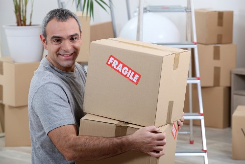 Packed boxes and furniture ready for local removal transport