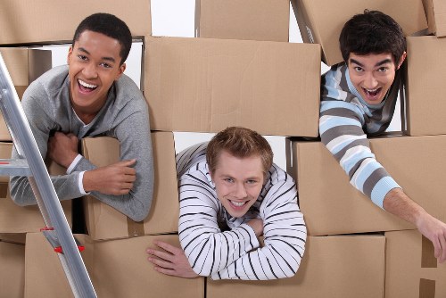 Professional movers loading items for a Kenton relocation