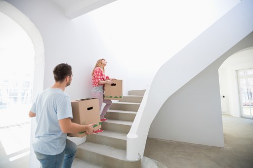Professional movers packing furniture for a Kenton home move