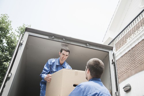 Movers handling packed office equipment during a Kenton commercial move