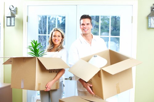 Helper carrying boxes for a Kenton moving job